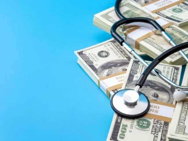 stethoscope and cash